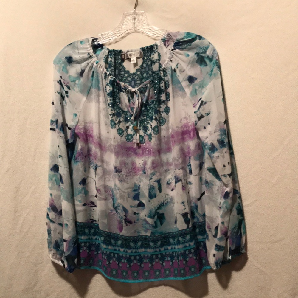 Jennifer Lopez Brand sheer print blouse.
